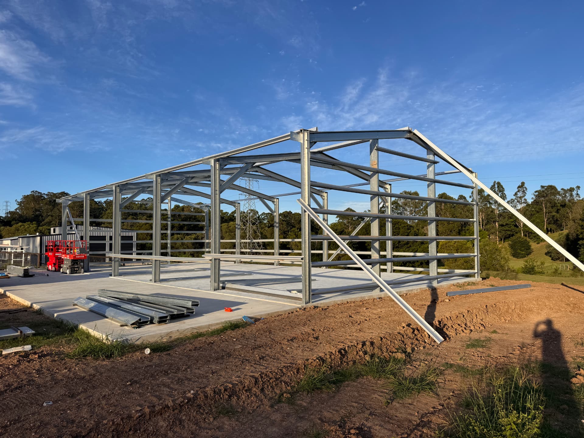 Structural steel shed frame erected on a new concrete slab